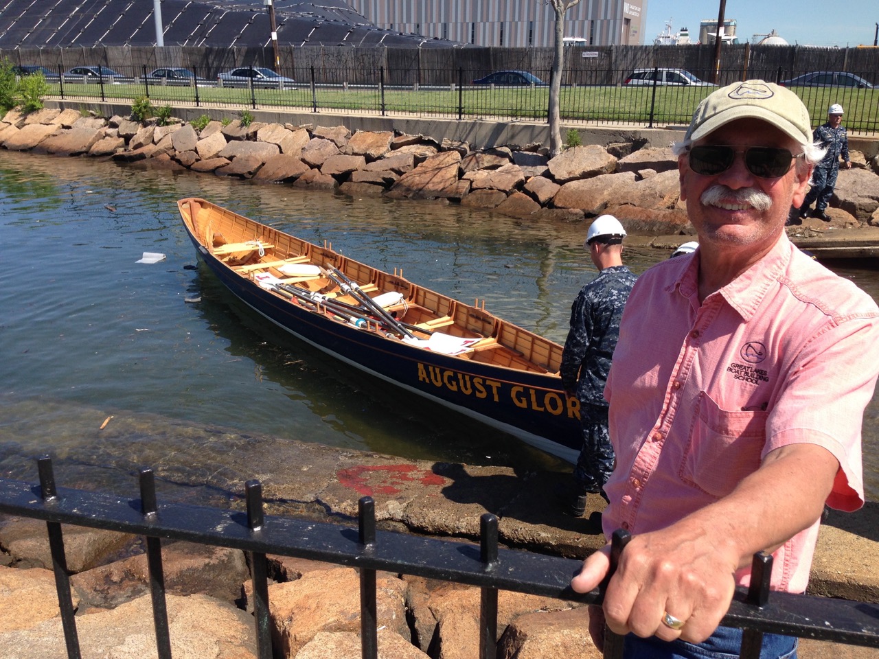 Pat at the historic Charlestown Naval Yard in Boston, MA watching the launching of the pilot gig August Glory by the US Navy that was built by his students at that Great Lakes Boat Building School to compliment the USS Constitution.
