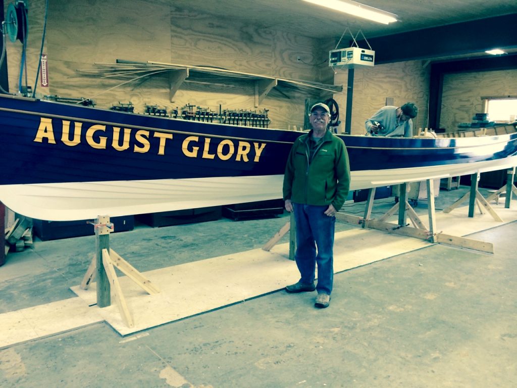Pat at the historic Charlestown Naval Yard in Boston, MA watching the launching of the pilot gig August Glory by the US Navy that was built by his students at that Great Lakes Boat Building School to compliment the USS Constitution.